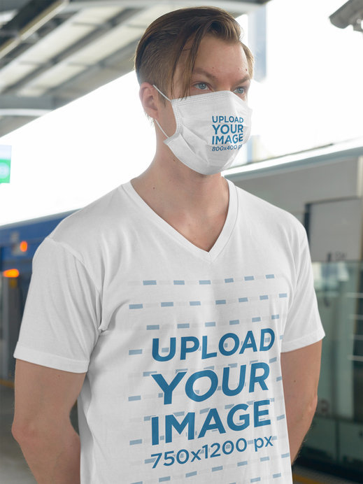 T-Shirt Mockup of a Man Wearing a Face Mask at the Train Station