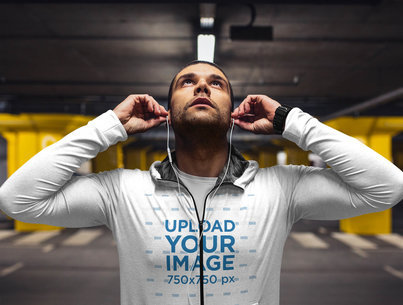 Hoodie Mockup of a Man Putting on His Earphones While to Exercise 41428-r-el2
