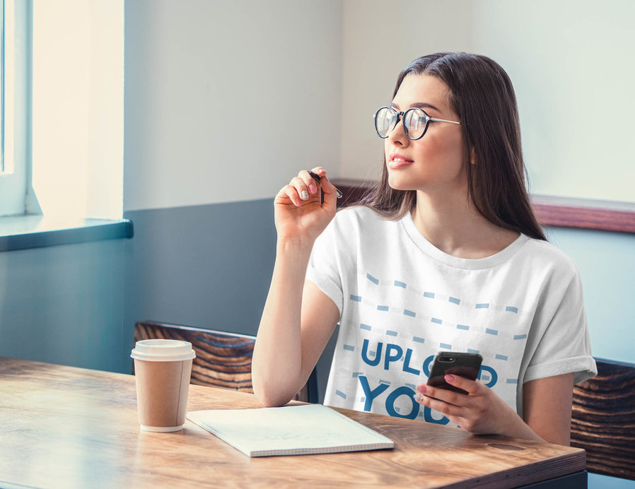 T-Shirt Mockup of a Woman Taking Notes at a Restaurant 
