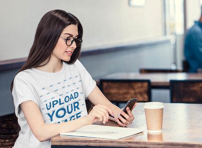 T-Shirt Mockup of a Woman with Glasses Studying at a Coffee Shop 35506-r-el2