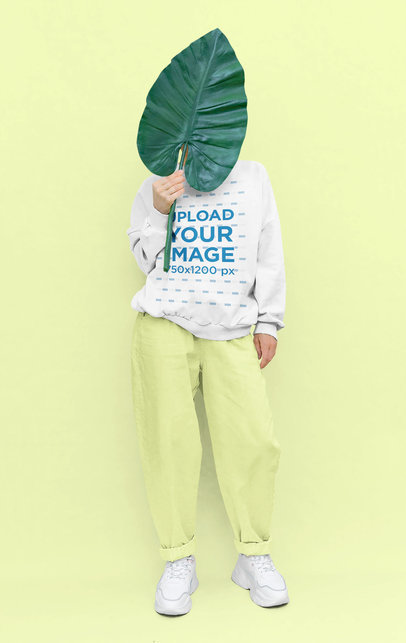 Sweatshirt Mockup of a Woman Using a Leaf Prop in a Studio 43671-r-el2