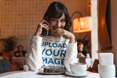 Sweatshirt Mockup of a Shy Woman Talking on the Phone 