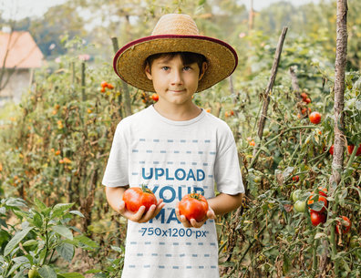 T-Shirt Mockup Featuring a Boy Picking Tomatoes