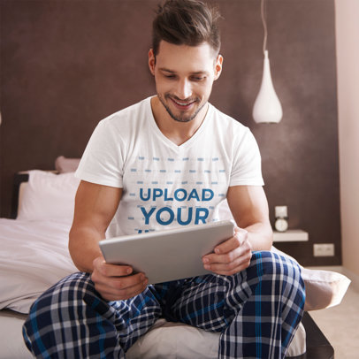 V-Neck T-Shirt Mockup of a Man Using a Tablet in the Morning 35694-r-el2