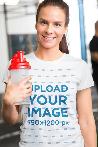 T-Shirt Mockup Featuring a Smiling Woman at the Gym