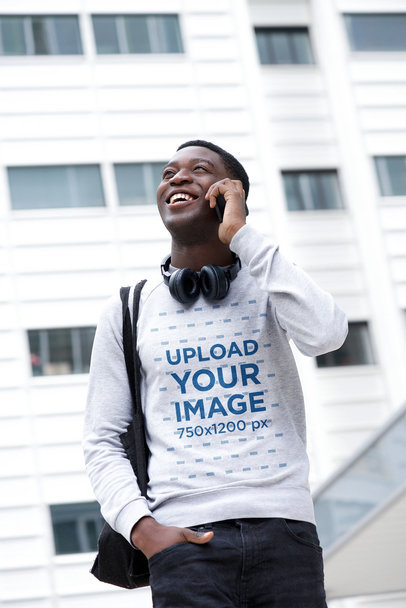 Sweatshirt Mockup of a Man on the Street Talking on the Phone 
