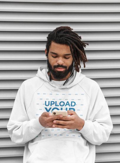 Pullover Hoodie Mockup of a Serious Bearded Man Listening to Music 