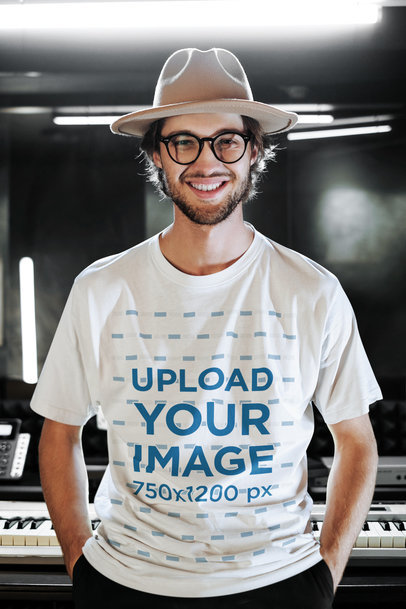 Mockup of a Musician Wearing an Oversize T-Shirt at a Recording Studio