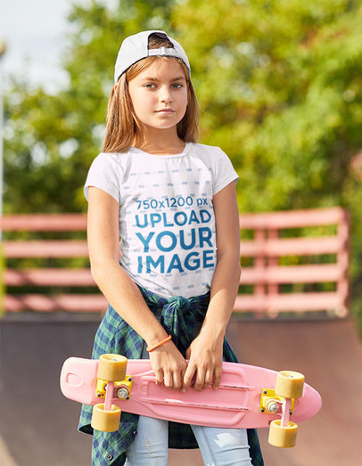 T-Shirt Mockup Featuring a Serious Girl at a Skatepark 