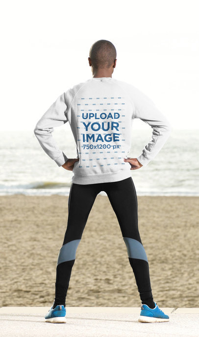 Back-View Mockup of a Man Wearing a Sweatshirt by the Beach