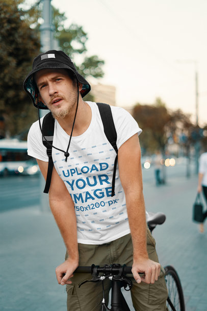 Tee Mockup of a Serious Bearded Man Riding a Bike 