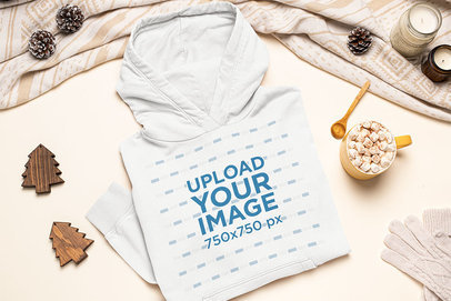 Christmas Mockup Featuring a Folded Pullover Hoodie Placed by Some Ornaments m144