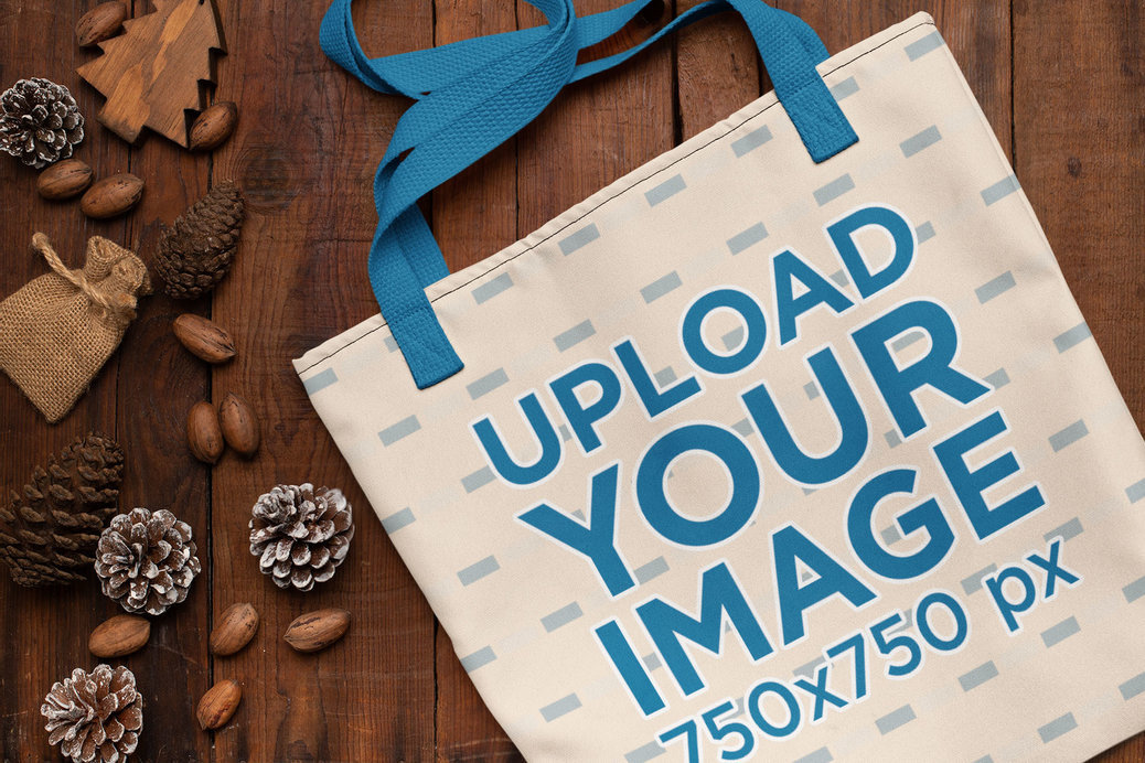 Mockup of a Flat Laid Tote Bag in a Winter-Season Setting