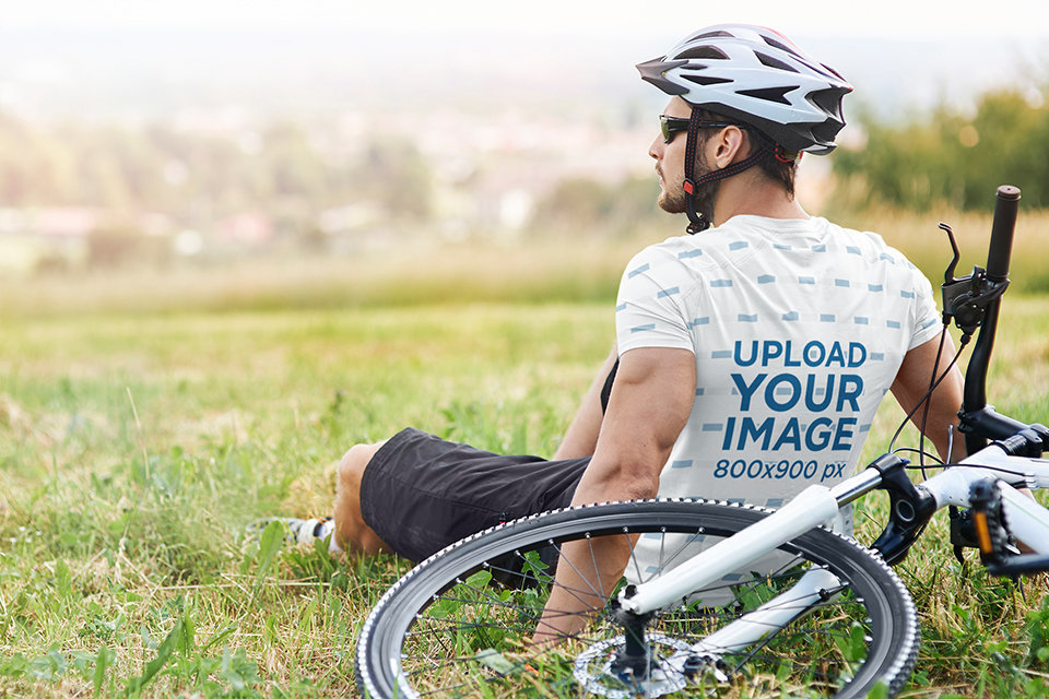 Back-View Mockup of a Biker Wearing a Sublimated T-Shirt