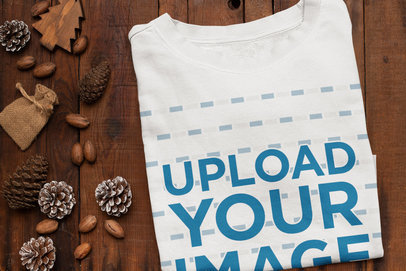 Mockup of a Folded Sweatshirt Surrounded by Winter Decorations