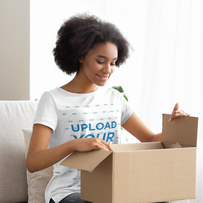 T-Shirt Mockup Featuring a Woman Opening a Box 39949-r-el2