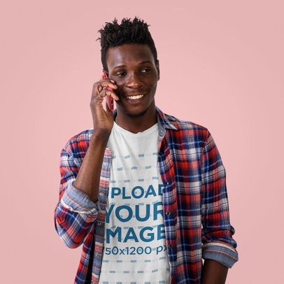 Studio Mockup of a Man in a T-Shirt Talking on the Phone