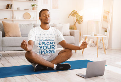 T-Shirt Mockup of a Man Doing Yoga at Home
