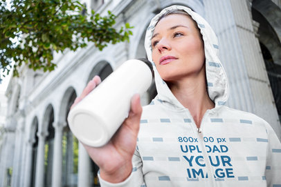 Sublimated Full-Zip Hoodie Mockup of a Woman Drinking Water