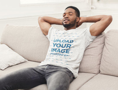 Heather T-Shirt Mockup of a Man Chilling in His Living Room