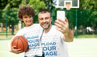 T-Shirt Mockup Featuring a Dad and His Son Taking a Selfie at a Basketball Court 