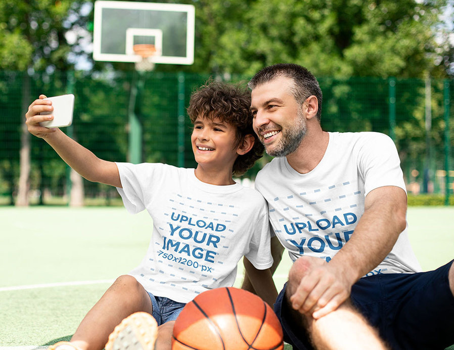 T-Shirt Mockup Featuring a Kid and His Father Taking a Selfie at a Basketball Court 