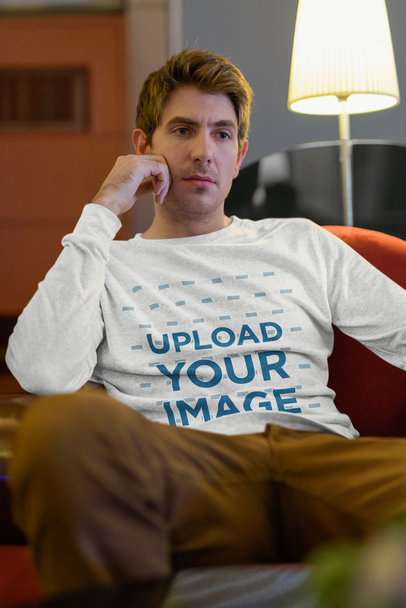 Long Sleeve Tee Mockup Featuring a Serious Man at Home