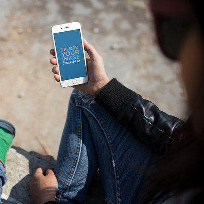 Mockup of a Young Woman Checking Up Her iPhone 6