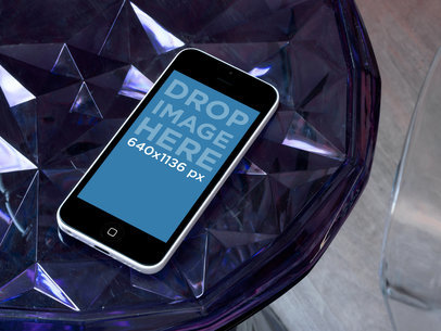 Mockup of an iPhone 5C on a Glass Table
