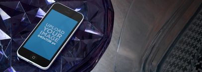 Wide Mockup of an iPhone 5C Placed over a Glass Surface