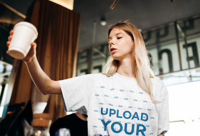 Mockup of a Barista Wearing an Oversized T-Shirt at Work