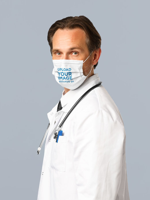 Placeit - Face Mask Mockup Featuring a Middle-Aged Doctor at a Studio