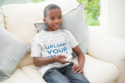 T-Shirt Mockup of a Kid Watching TV on a Couch 43919-r-el2