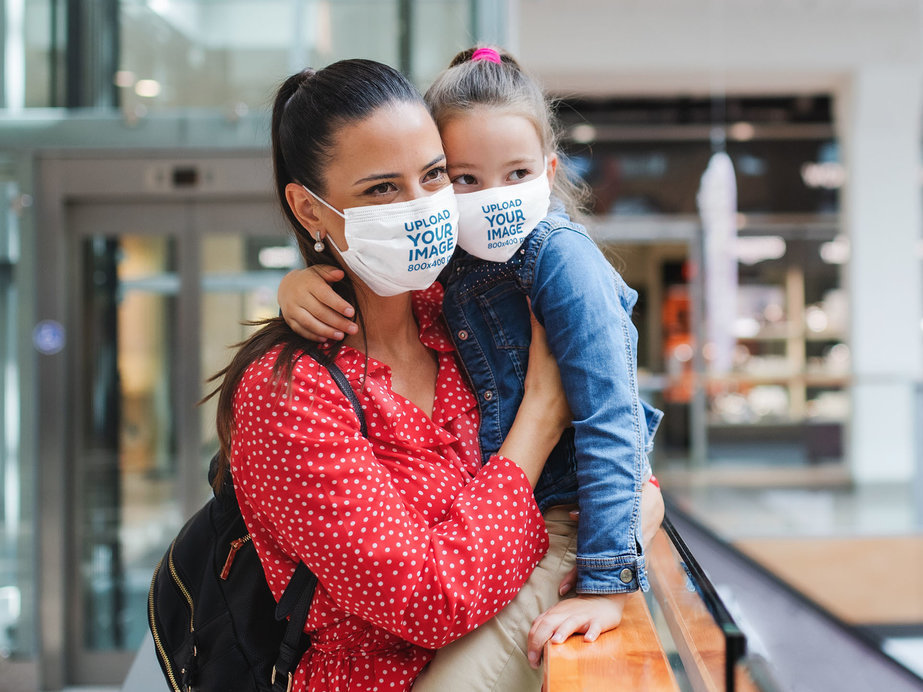 Face Mask Mockup of a Mother and Her Daughter at a Mall