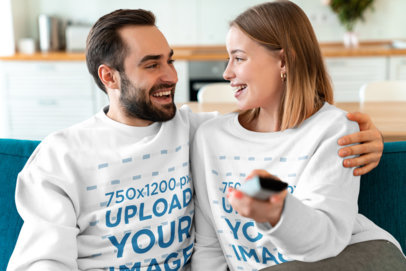 Mockup of a Couple Wearing Sweatshirts at Home 