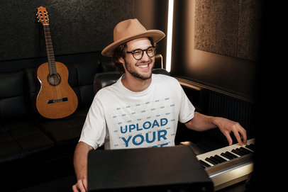 T-Shirt Mockup Featuring a Happy Man Playing Music at a Recording Studio 40165-r-el2