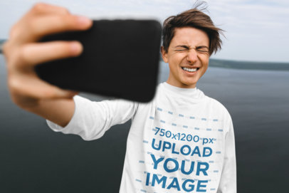 Long-Sleeve Tee Mockup of a Teenager Taking a Selfie 