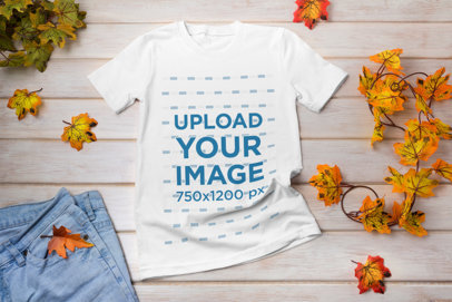 Mockup Featuring a T-Shirt and Fall Leaves Placed on a Wooden Table 41383-r-el2