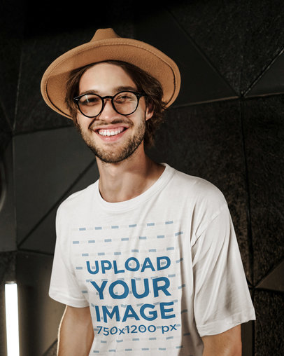 T-Shirt Mockup of a Joyful Bearded Man Posing Against a Dark Wall 40207-r-el2
