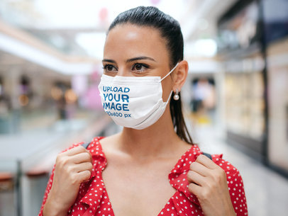 Mockup of a Woman Wearing a Face Mask in a Shopping Mall 