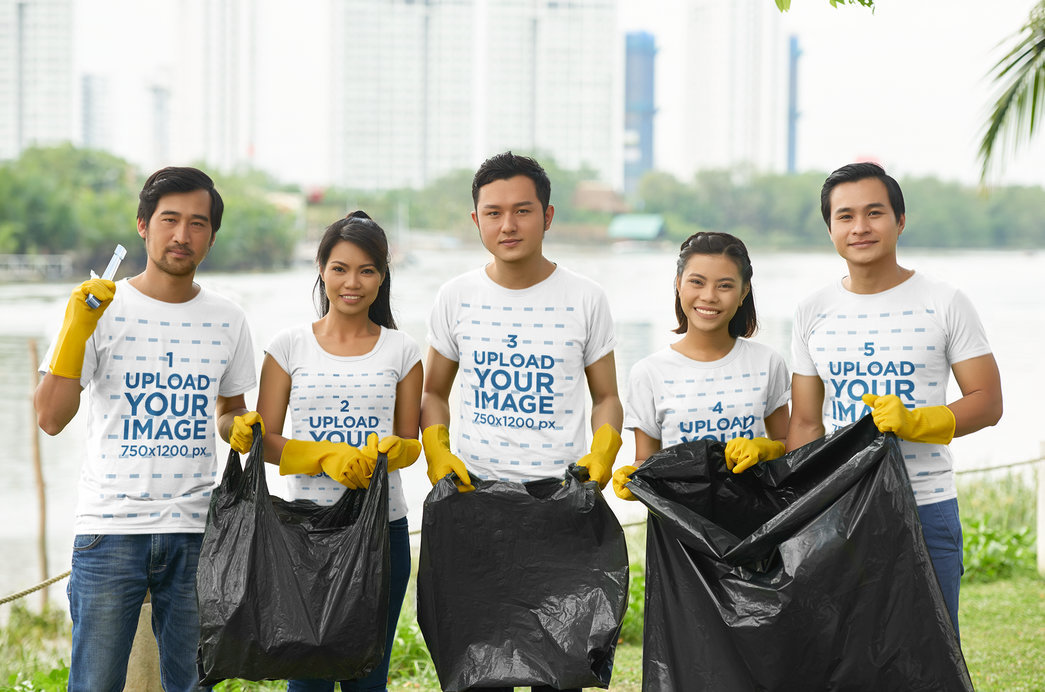 T-Shirt Mockup Featuring a Group of Five Cleaning a Public Space