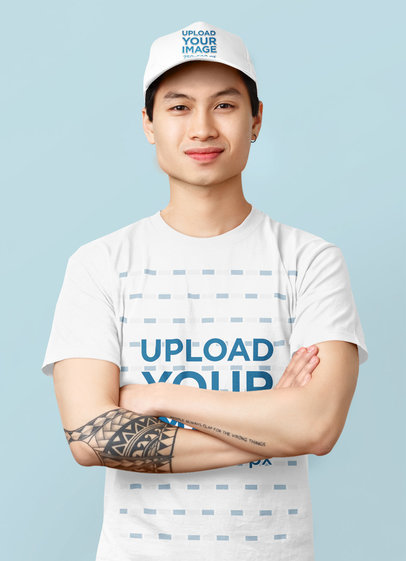 Mockup of a Man with a Tattoo Wearing a Dad Hat and a Basic T-Shirt 