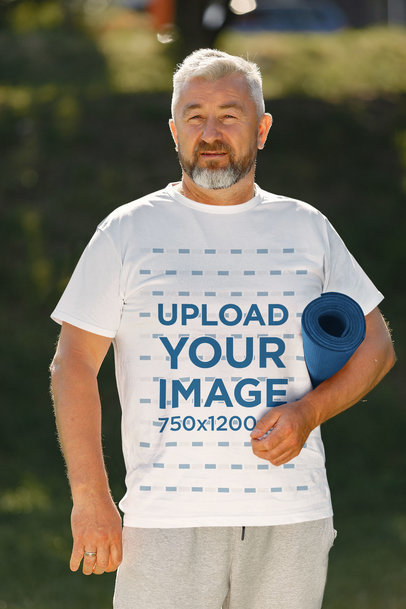 T-Shirt Mockup of an Elderly Man Holding an Exercise Mat 43880-r-el2