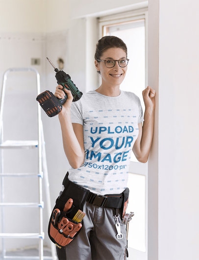 Heather T-Shirt Mockup of a Woman Holding a Drill