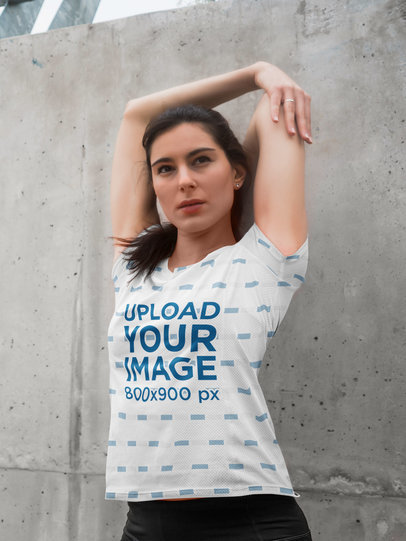 Sublimated T-Shirt Mockup of a Woman Stretching Her Arm