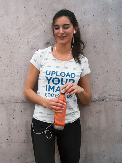 Mockup of a Woman Wearing a Sublimated T-Shirt While Resting