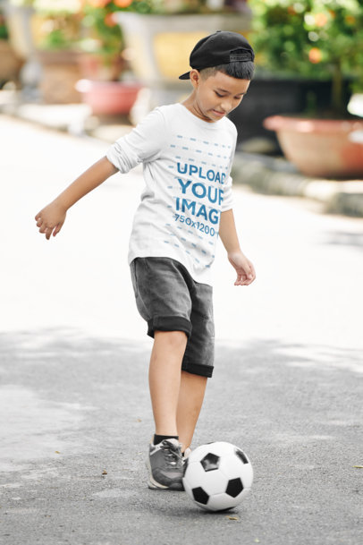 Long Sleeve Tee Mockup of a Boy Playing with a Soccer Ball
