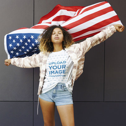 Mockup of a Woman with a Basic T-Shirt Waving an American Flag 