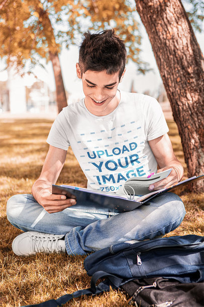 T-Shirt Mockup Featuring a Happy Freshman on Campus
