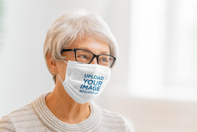 Face Mask Mockup Featuring a Kind Senior Woman